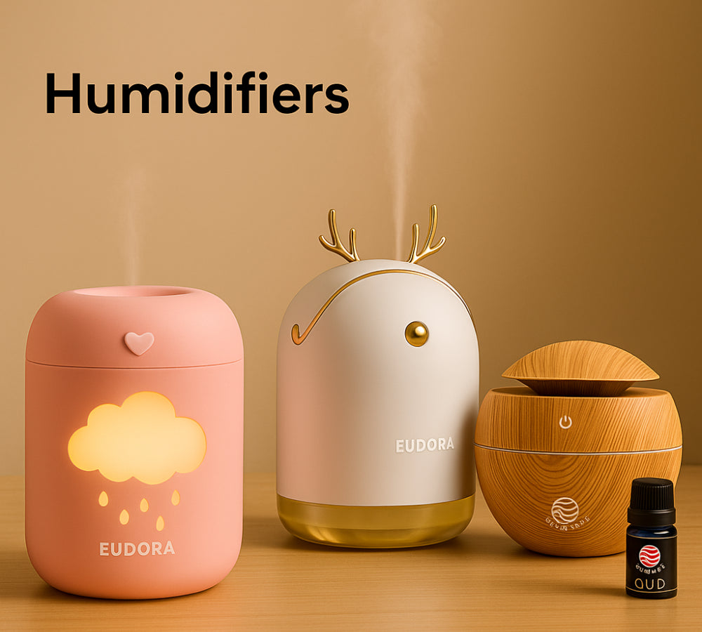 Three humidifiers with different designs on a wooden surface and beige background.